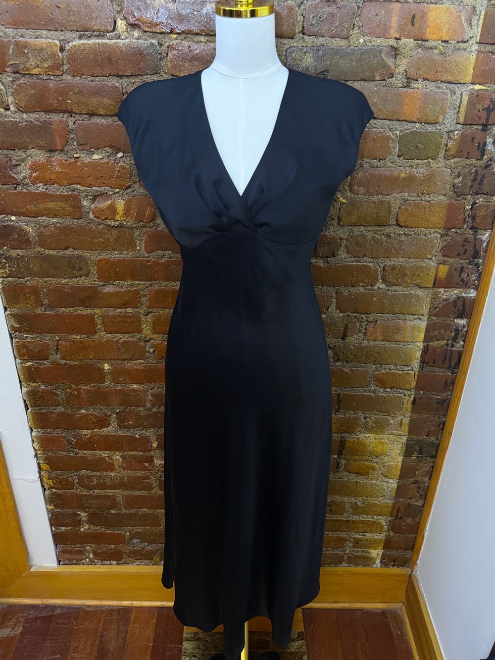 Elegant Black Silk V-Neck Midi Dress with Structured Shoulders